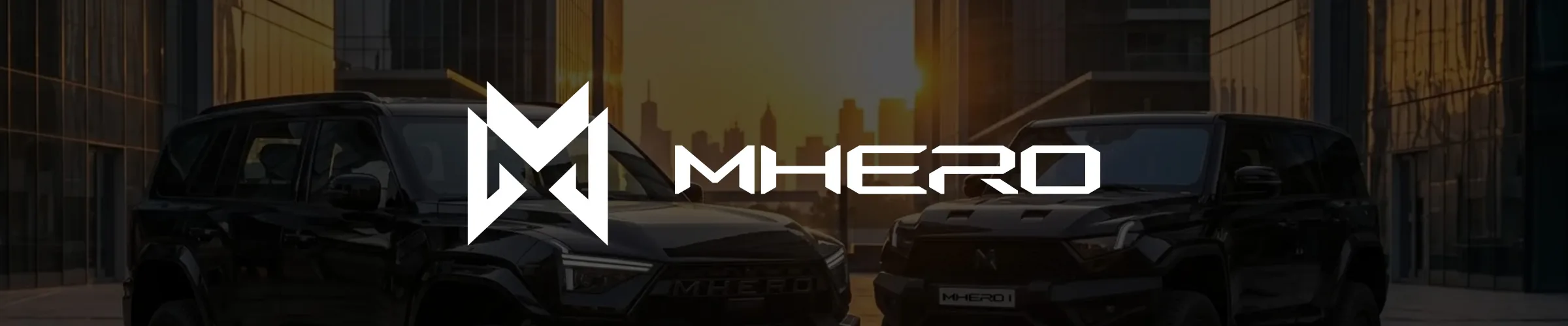 The MHERO wordmark and monogram over the MHERO I and MHERO II against a city skyline at dusk.