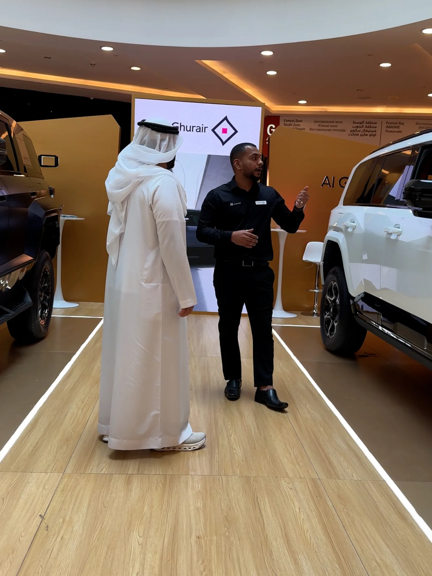 A Promocell ambassador talking a visitor through the MHERO range at the indoor stand.